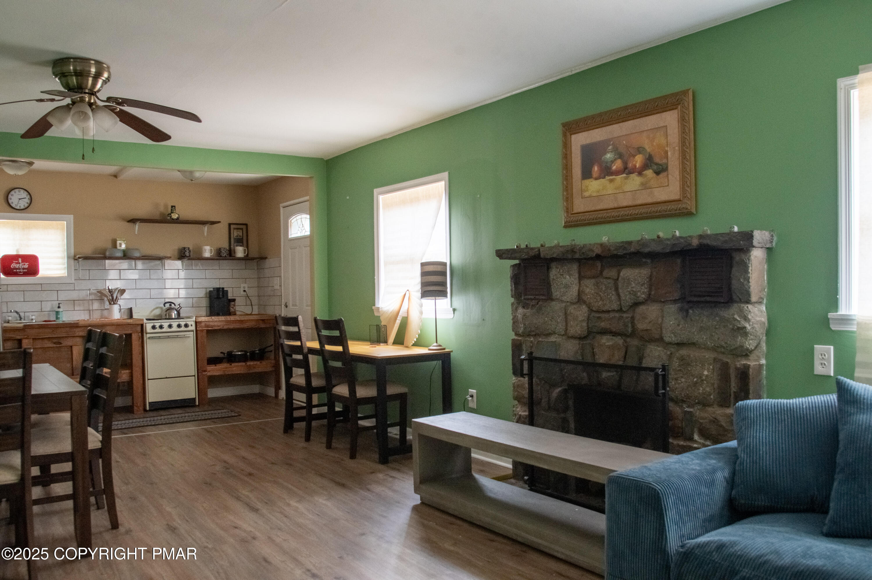 111 Rippling Brook Road Canadensis, PA 18325 - Photo 33 of 50 a living room with furniture and a fireplace