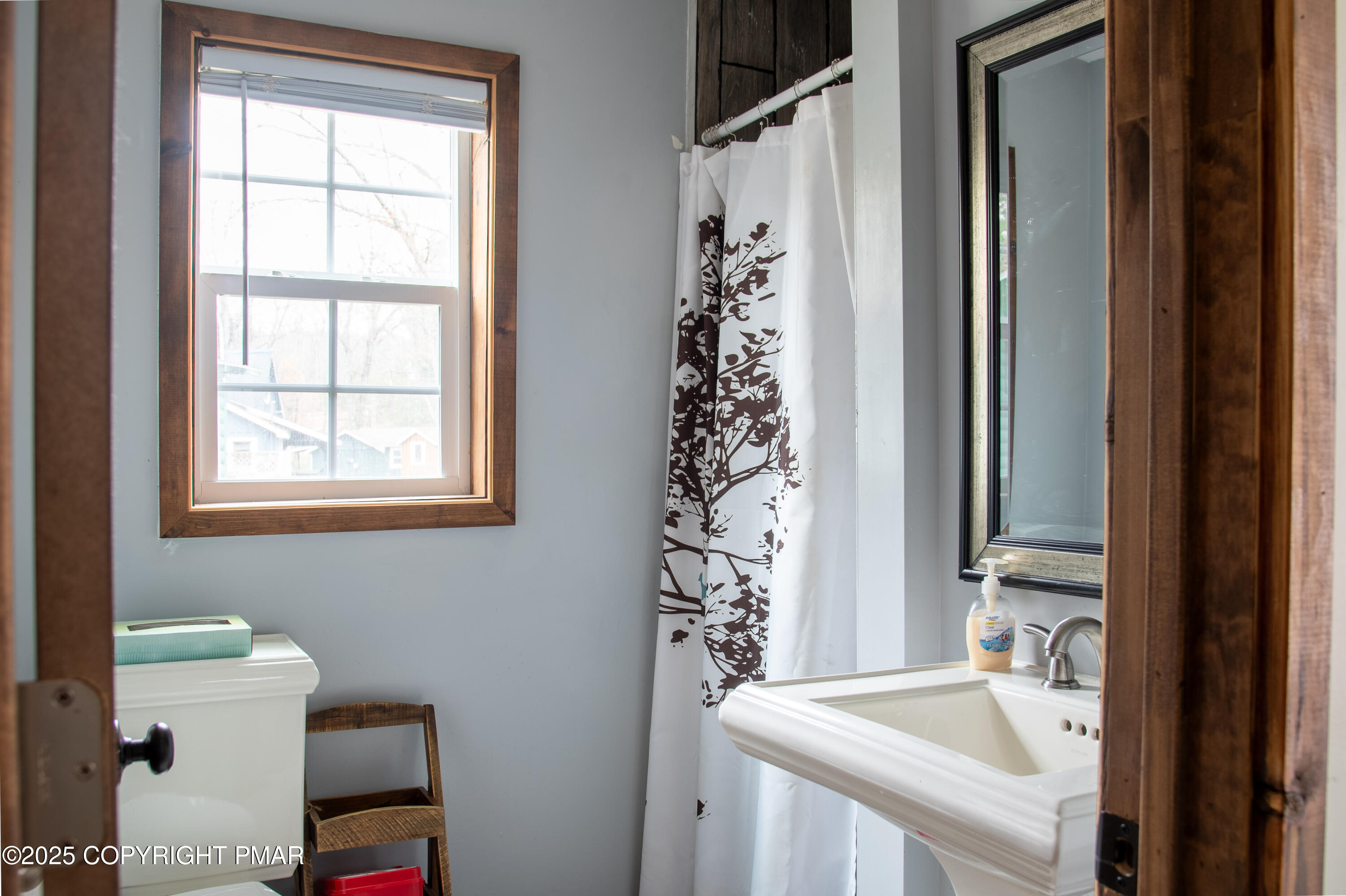 111 Rippling Brook Road Canadensis, PA 18325 - Photo 41 of 50 a bathroom with a sink a toilet and a window