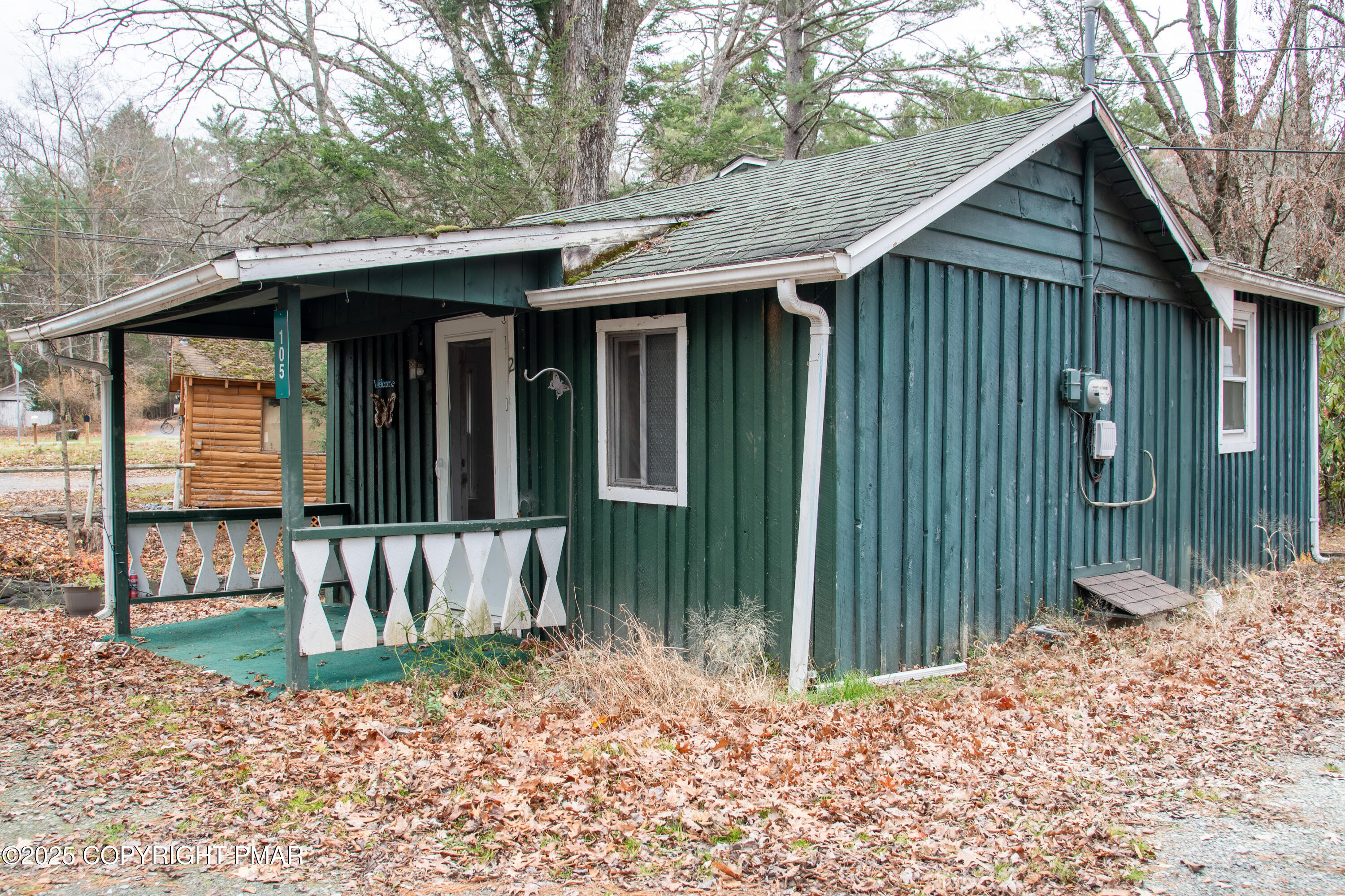 111 Rippling Brook Road Canadensis, PA 18325 - Photo 9 of 50 a view of a house with a small yard and wooden fence