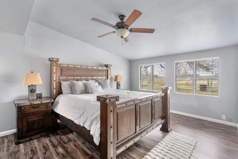 a bed room with a bed and a mirror