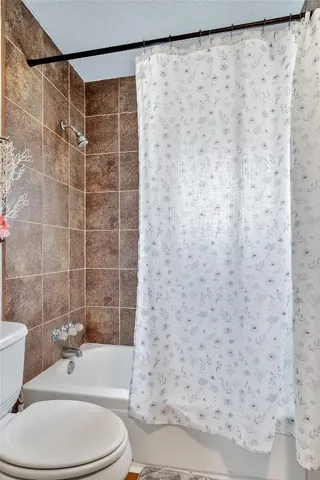 a front view of a house with a yard and outdoor seating