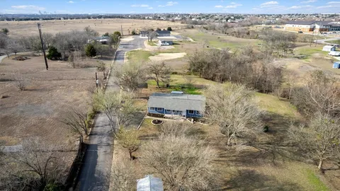 a view of a lake with beach and city view