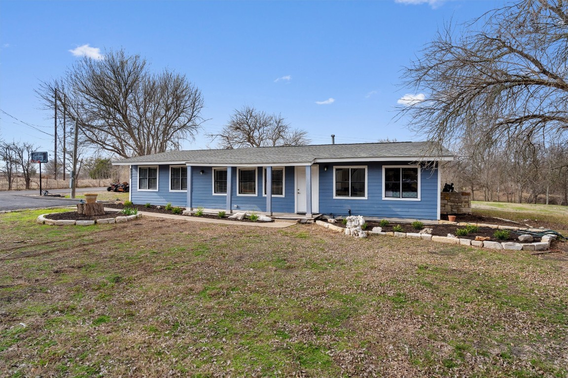 2203 Windy Hill Road Kyle, TX 78640 - Photo 7 of 29 a view of a house with a patio