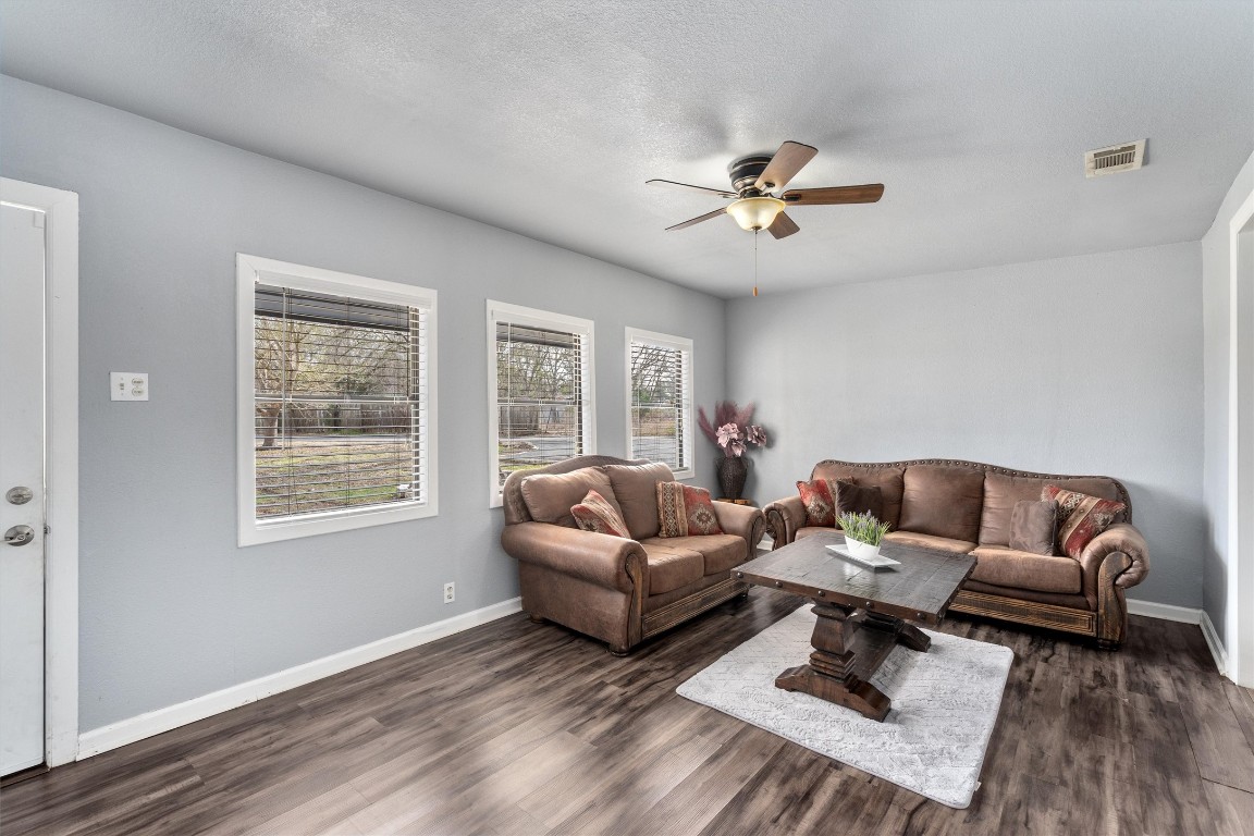2203 Windy Hill Road Kyle, TX 78640 - Photo 10 of 29 a living room with furniture a rug and a window