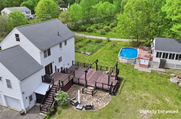 an aerial view of a house having yard