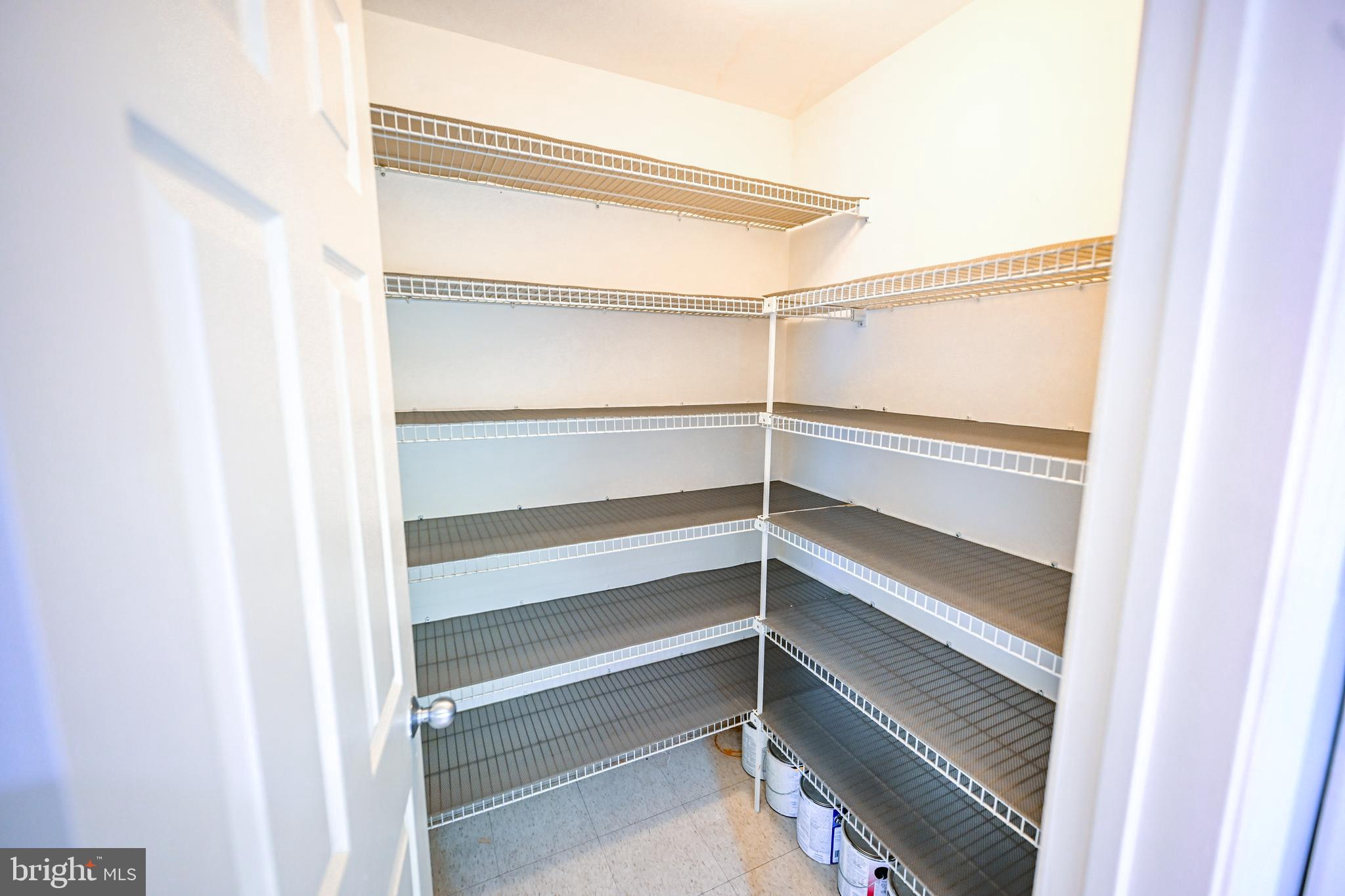 2515 Boston Street, Unit 1108 Baltimore, MD 21224 - Photo 9 of 46 a view of walk in closet with empty racks