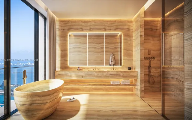 a bathroom with a bathtub and next to a window