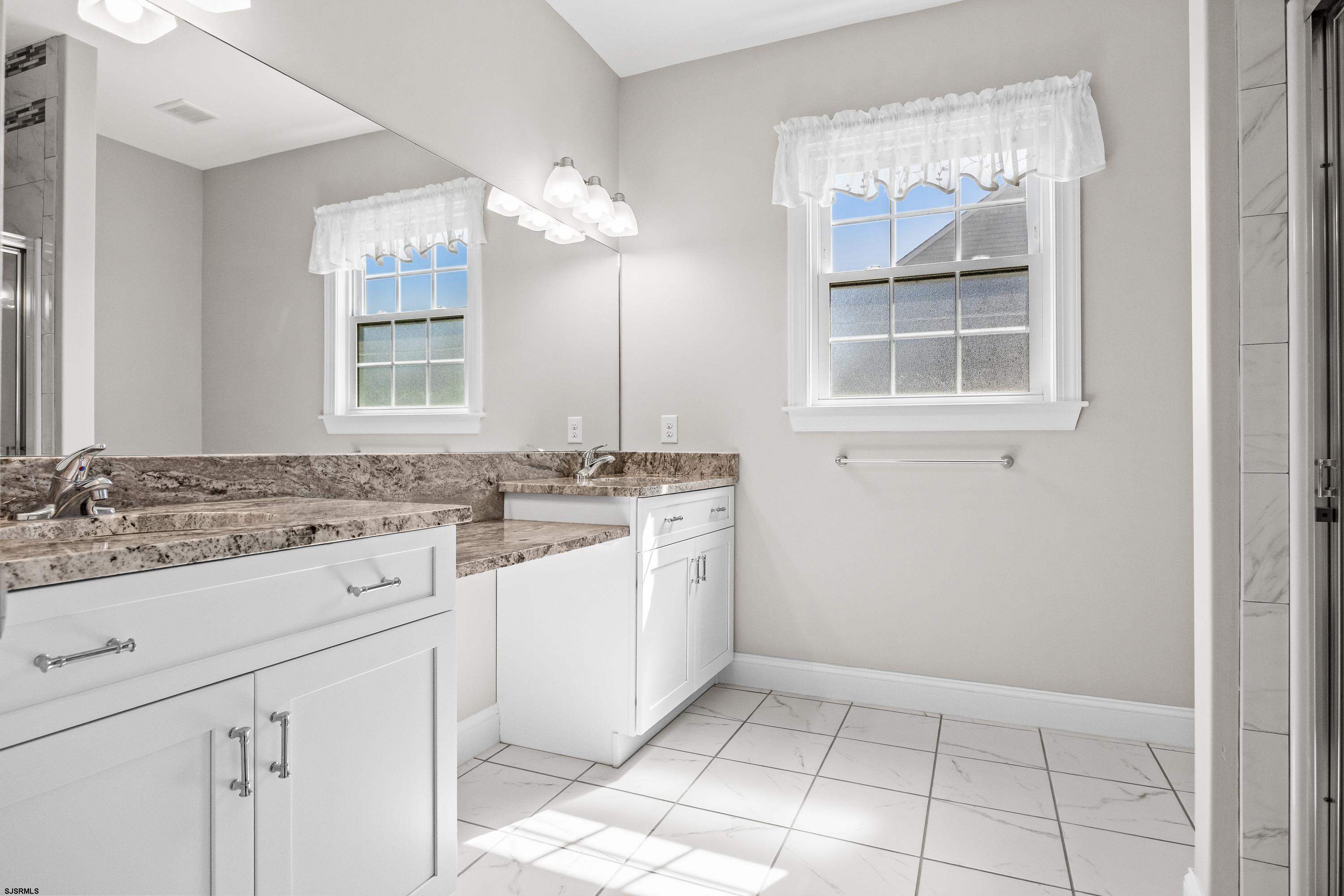 215 Surf Road Egg Harbor Township, NJ 08234 - Photo 16 of 31 a bathroom with a sink and a mirror