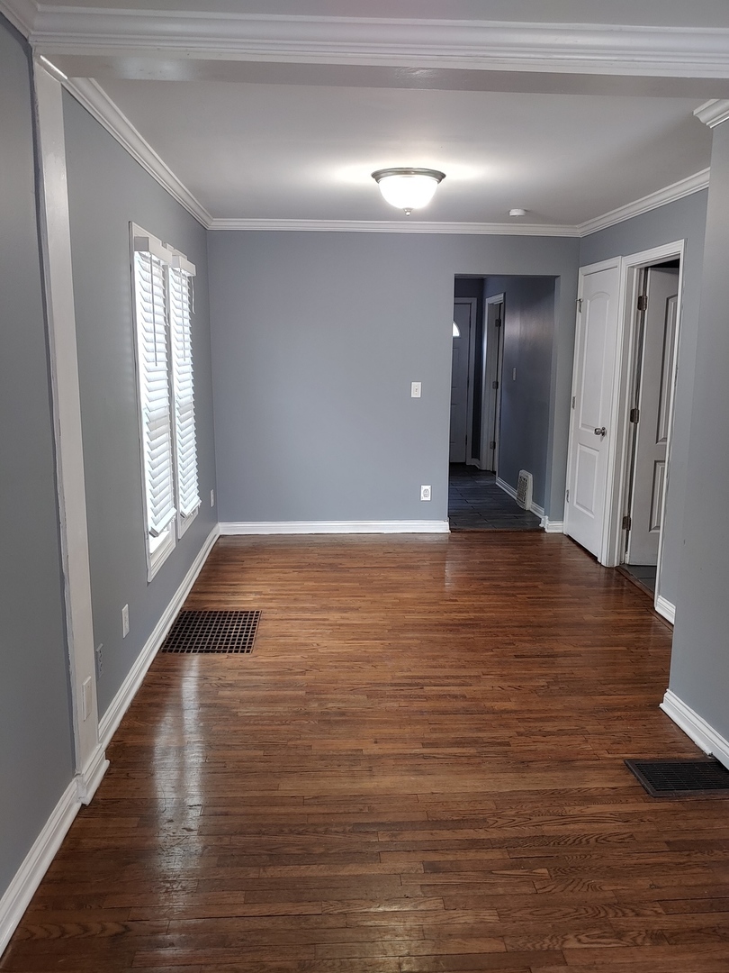 519 Prospect Place Joliet, IL 60436 - Photo 11 of 15 a view of wooden floor and windows in a room