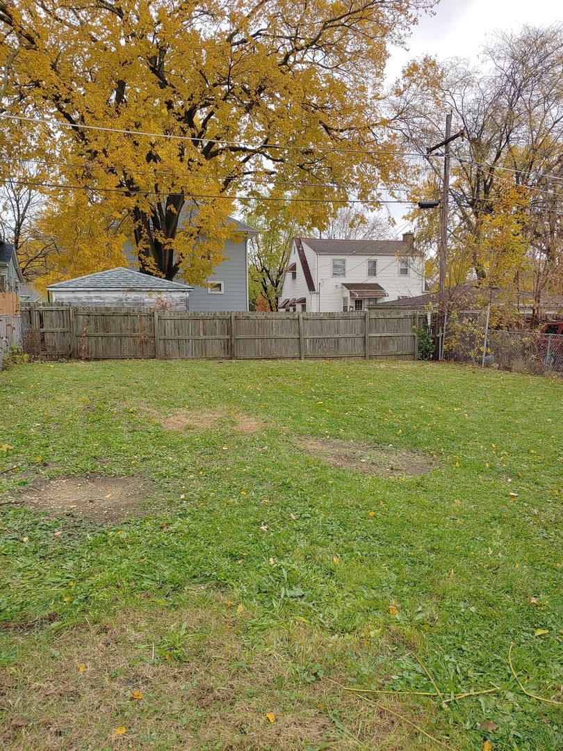 519 Prospect Place Joliet, IL 60436 - Photo 6 of 15 a view of a big yard in front of the house