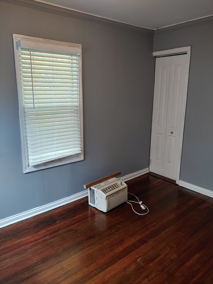 519 Prospect Place Joliet, IL 60436 - Photo 7 of 15 a view of room with hardwood floor and window