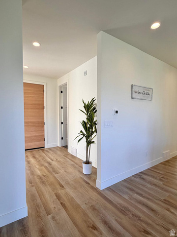 905 Settlement Canyon Road Tooele, UT 84074 - Photo 10 of 12 Entryway featuring wood-finish flooring, white baseboards, recessed lighting, and a paneled wood door