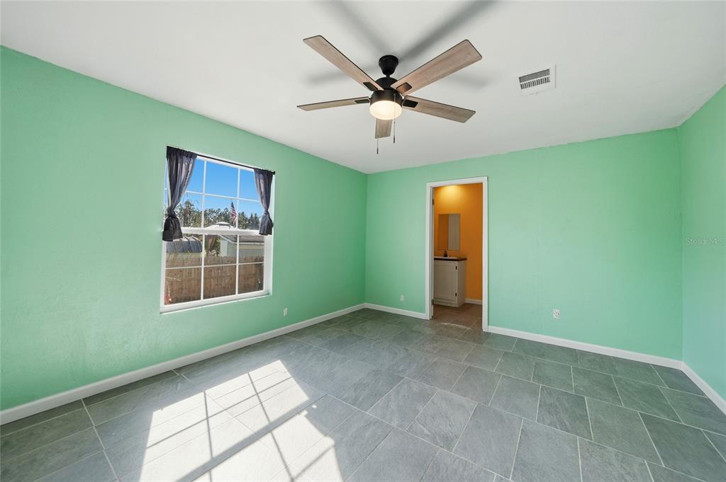 11337 Pineapple Road Punta Gorda, FL 33955 - Photo 12 of 25 a view of livingroom with window and ceiling fan