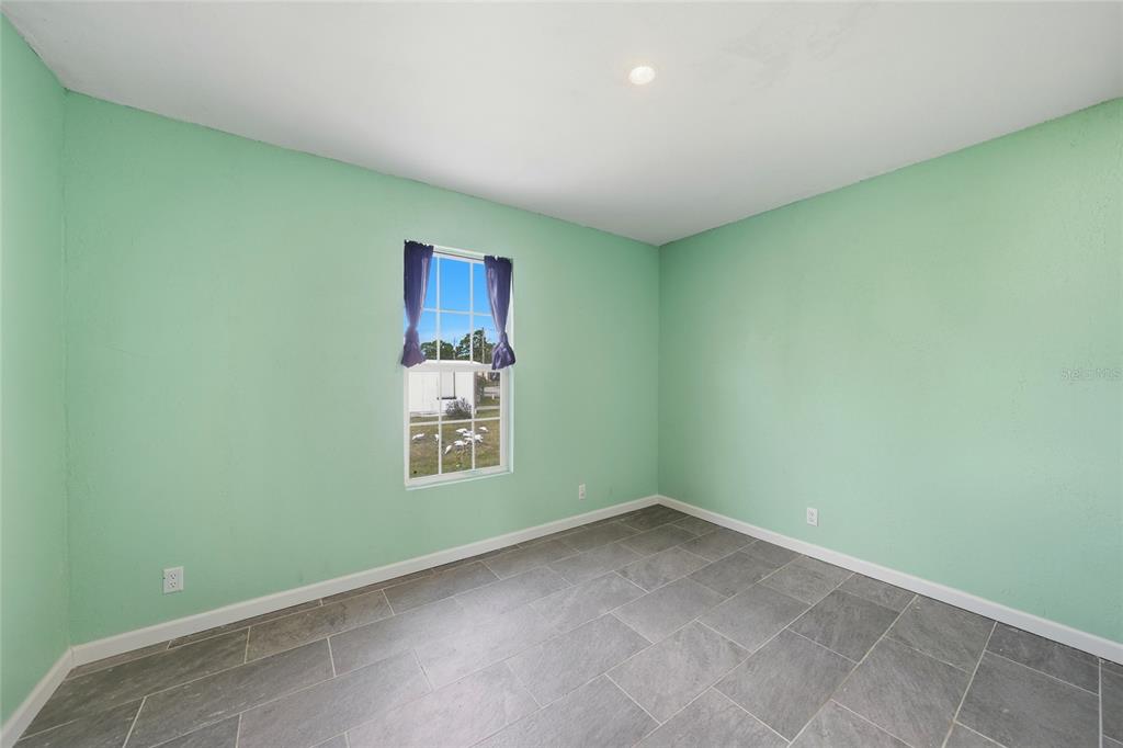 11337 Pineapple Road Punta Gorda, FL 33955 - Photo 15 of 25 a view of an empty room with a window