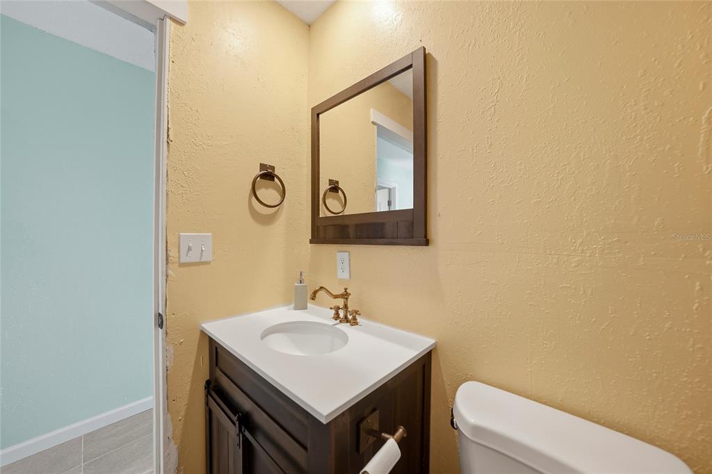 11337 Pineapple Road Punta Gorda, FL 33955 - Photo 18 of 25 a bathroom with a toilet a sink and mirror