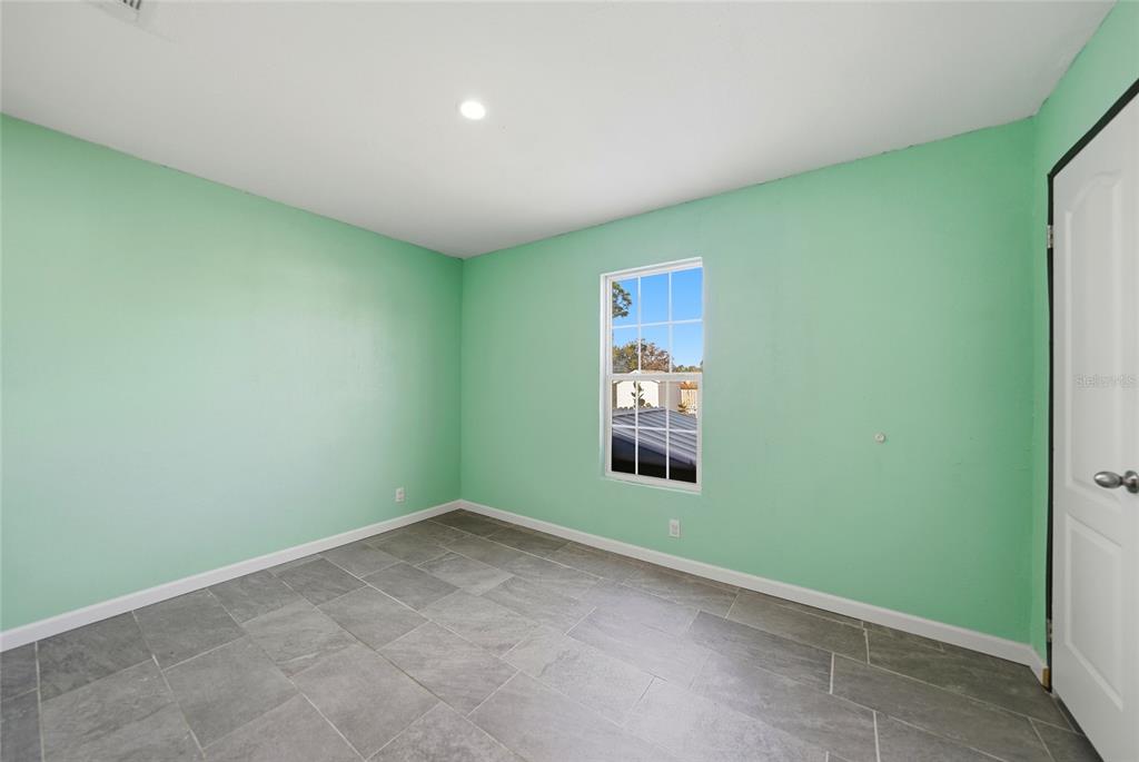 11337 Pineapple Road Punta Gorda, FL 33955 - Photo 19 of 25 an empty room with windows