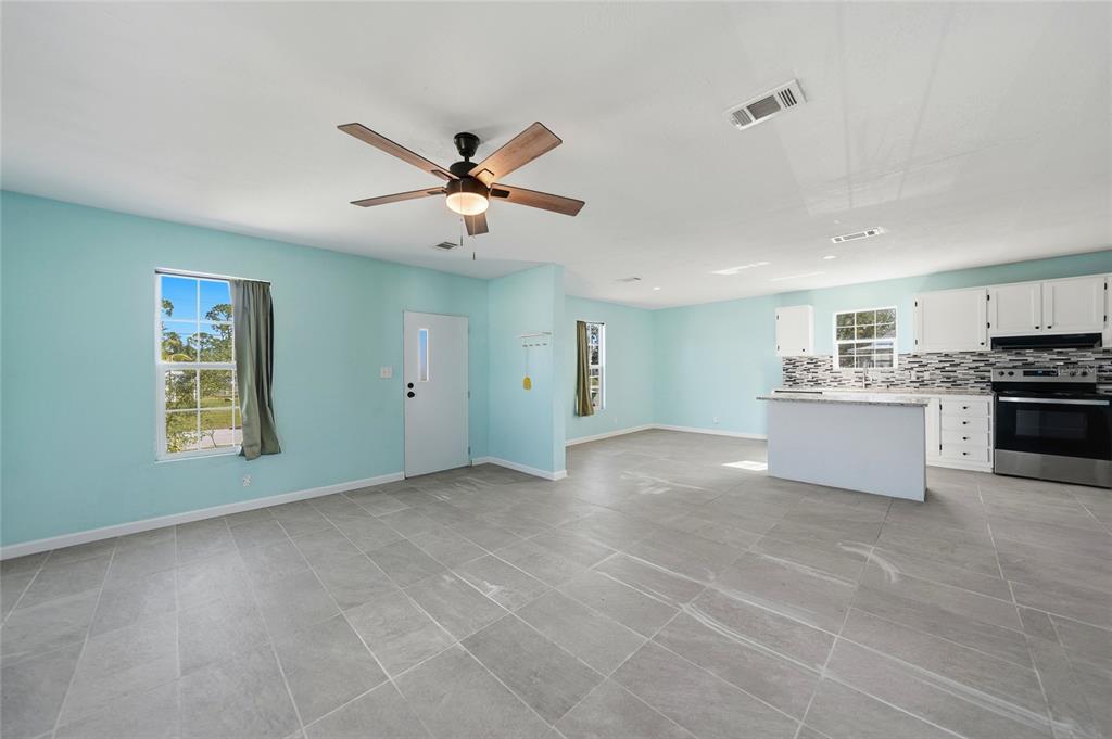 11337 Pineapple Road Punta Gorda, FL 33955 - Photo 4 of 25 a view of a kitchen with a sink and a window