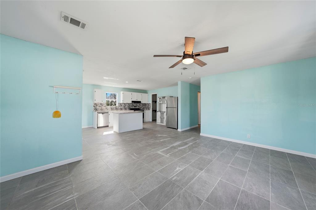 11337 Pineapple Road Punta Gorda, FL 33955 - Photo 5 of 25 a view of a kitchen with furniture and an empty room