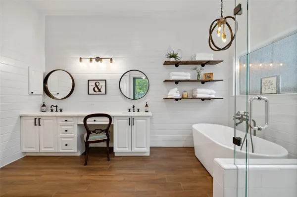 a view of a kitchen with a sink and a clock on the wall