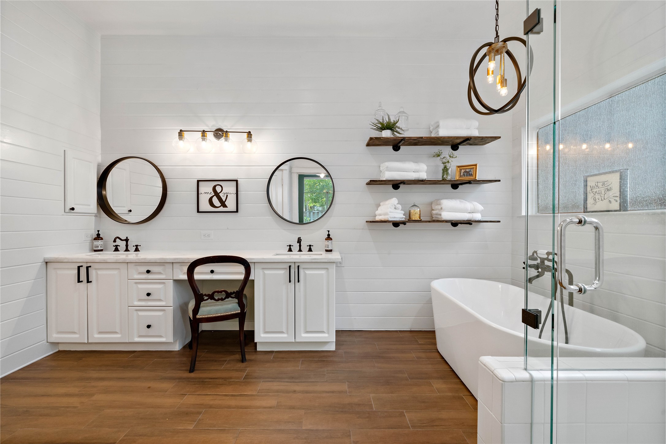 10 Vinca Trail Spring, TX 77382 - Photo 15 of 22 a view of a kitchen with a sink and a clock on the wall