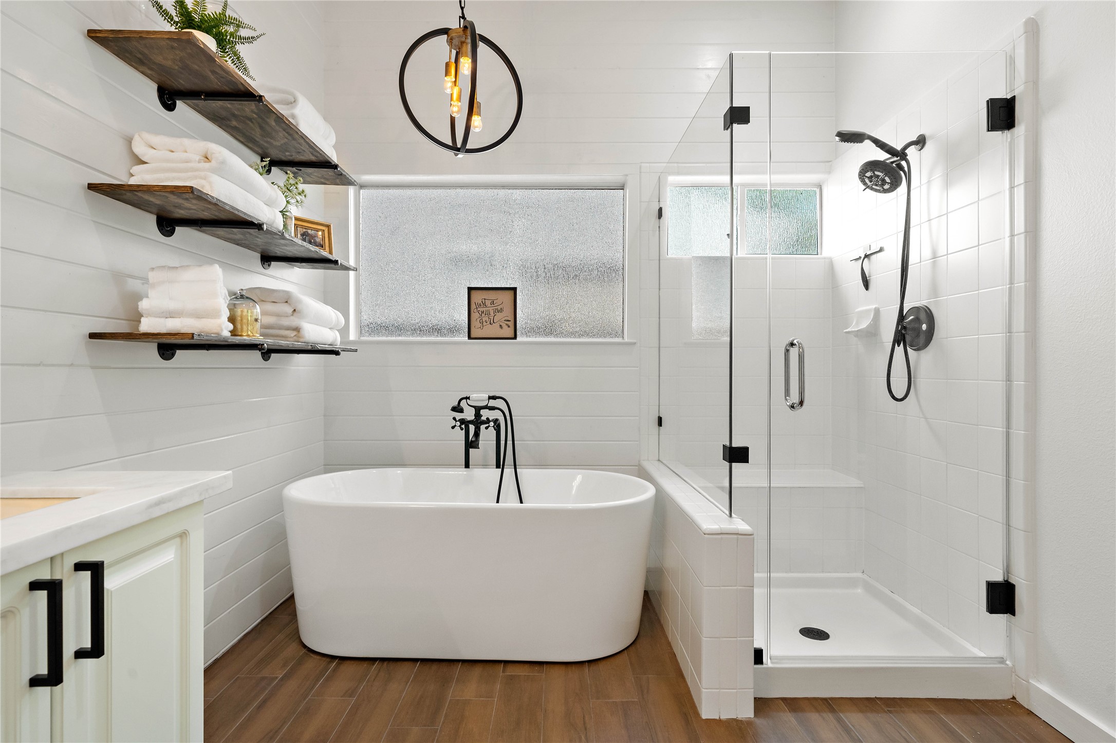 10 Vinca Trail Spring, TX 77382 - Photo 16 of 22 a bathroom with a sink a mirror and shower