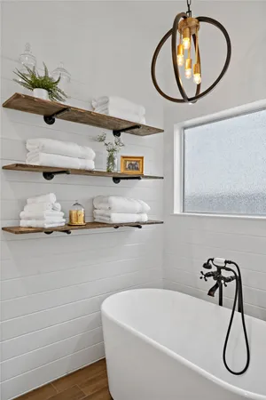 a bathroom with a sink and mirror