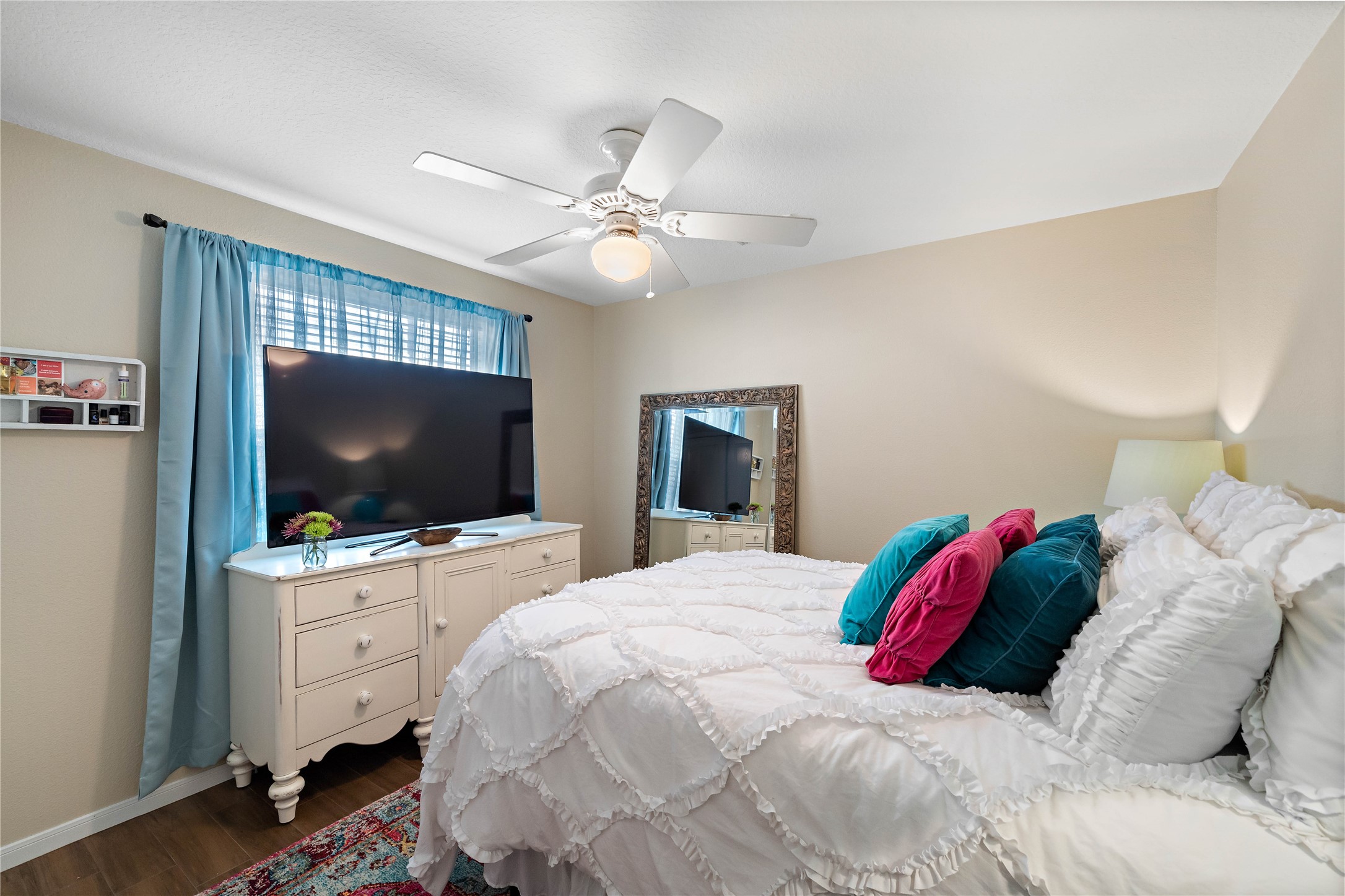 10 Vinca Trail Spring, TX 77382 - Photo 20 of 22 a bedroom with a bed and a flat screen tv