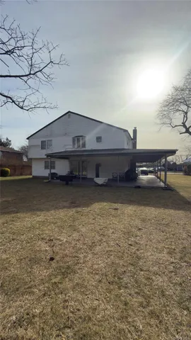 a living room with a table and a fireplace