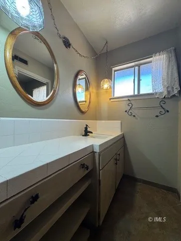 a white toilet sitting next to a bath tub