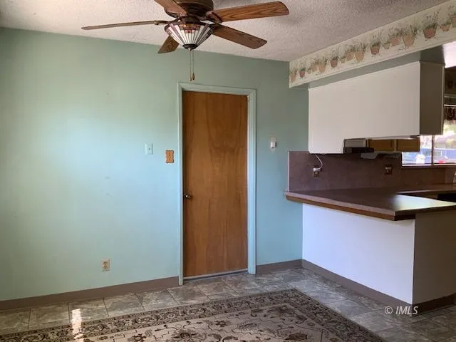 a kitchen with stainless steel appliances granite countertop a sink and a stove