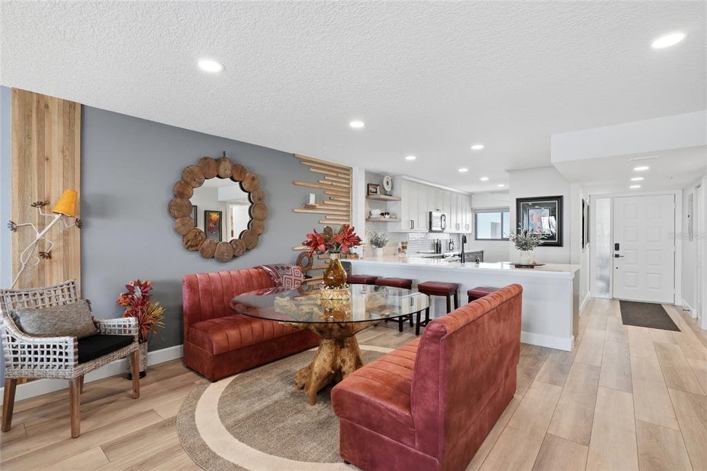 363 Pinellas Bayway South, Unit 29 Tierra Verde, FL 33715 - Photo 14 of 59 a living room with furniture kitchen and a large window