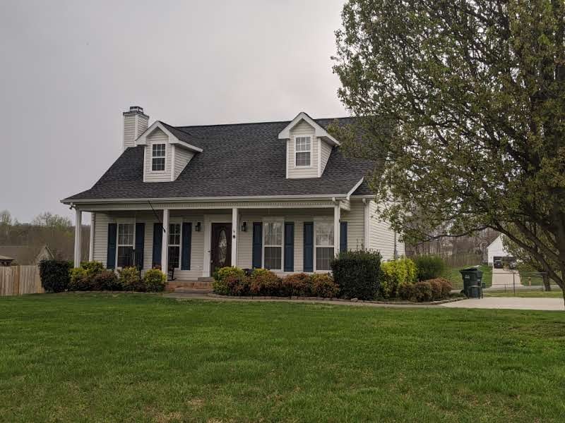 812 Blakemore Road Dickson, TN 37055 - Photo 1 of 25 a front view of a house with a garden
