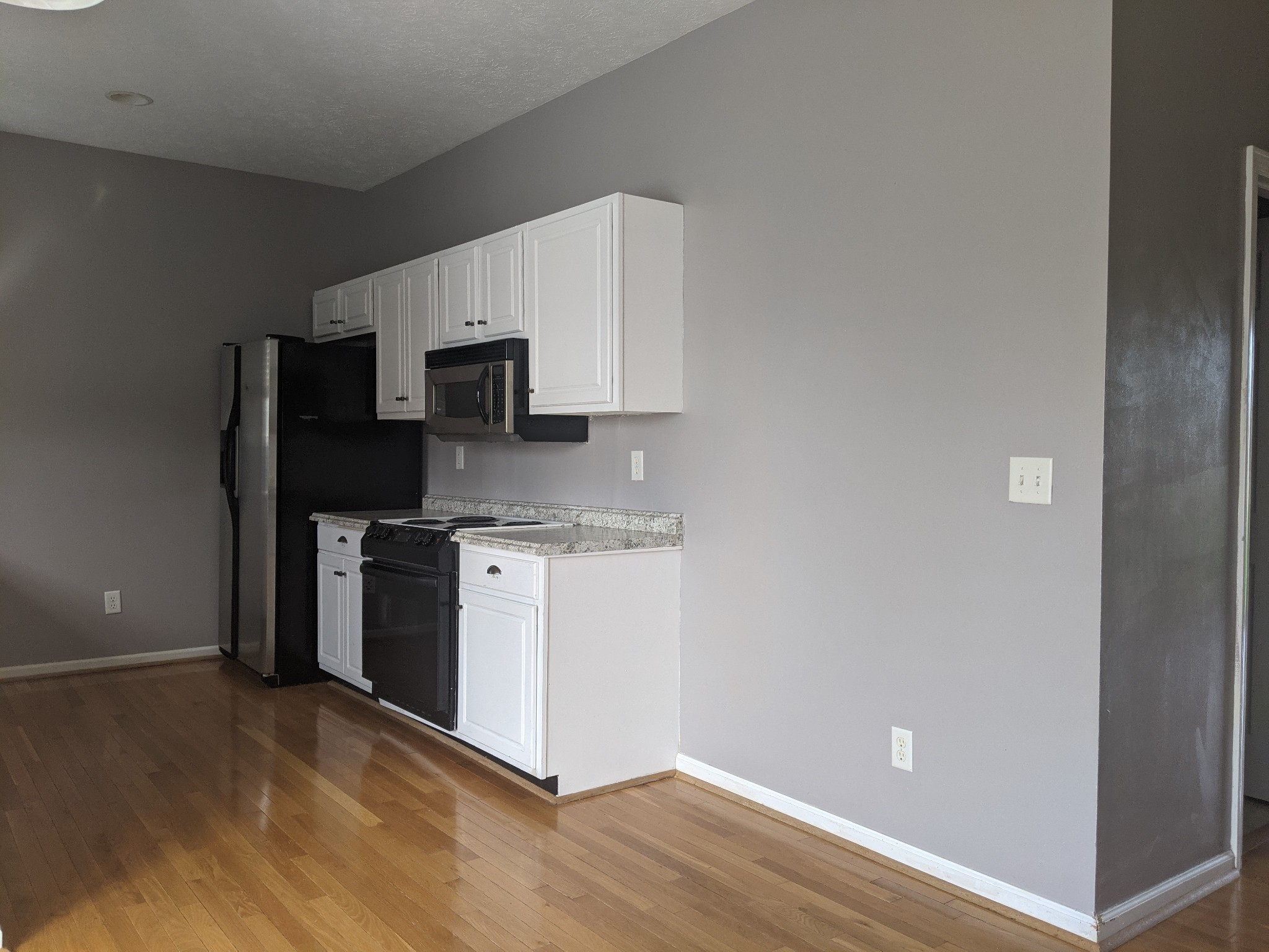 812 Blakemore Road Dickson, TN 37055 - Photo 12 of 25 a kitchen with a refrigerator and a stove top oven