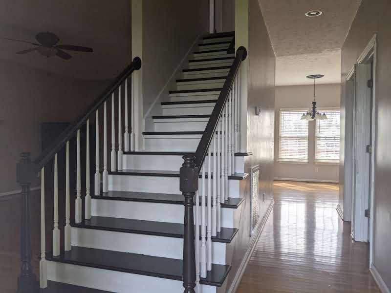 812 Blakemore Road Dickson, TN 37055 - Photo 16 of 25 a view of staircase with lots of frames on wall and wooden floor