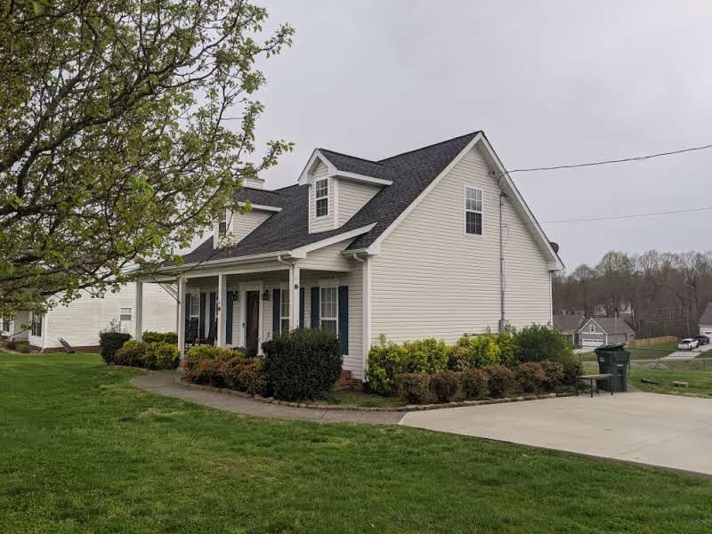 812 Blakemore Road Dickson, TN 37055 - Photo 3 of 25 a front view of a house with a garden