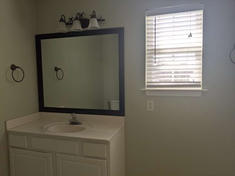 812 Blakemore Road Dickson, TN 37055 - Photo 21 of 25 a bathroom with a sink and mirror