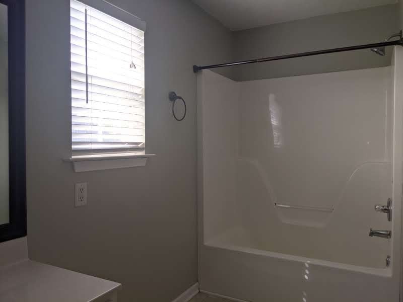 812 Blakemore Road Dickson, TN 37055 - Photo 22 of 25 a bathroom with a glass shower door