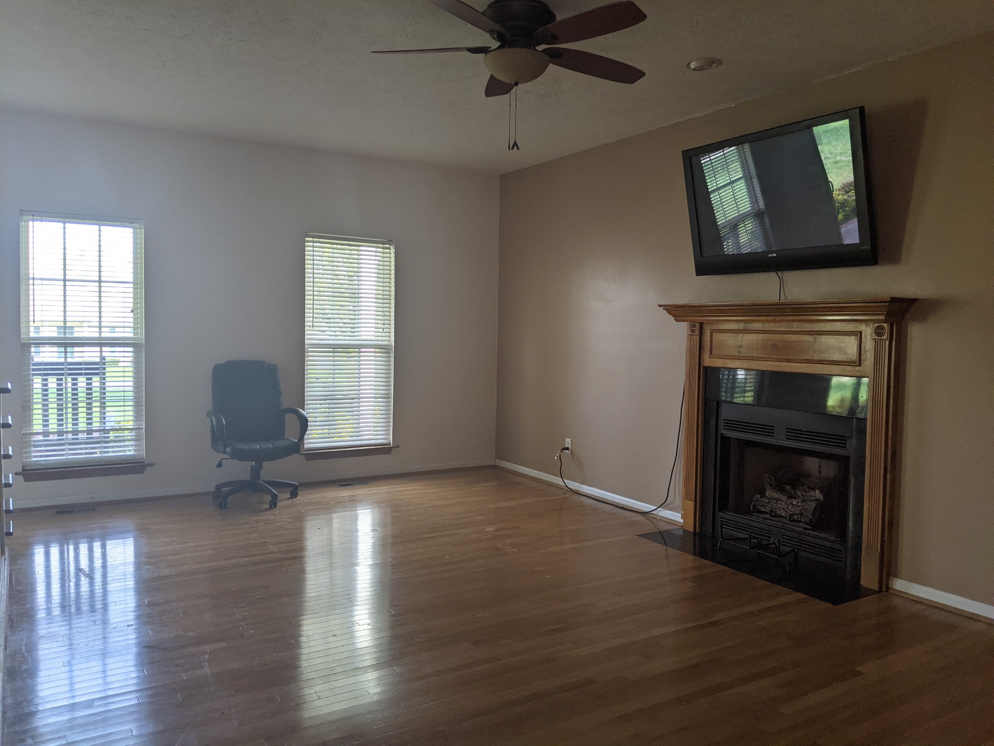 812 Blakemore Road Dickson, TN 37055 - Photo 7 of 25 a view of an empty room with exposed radiator and fireplace
