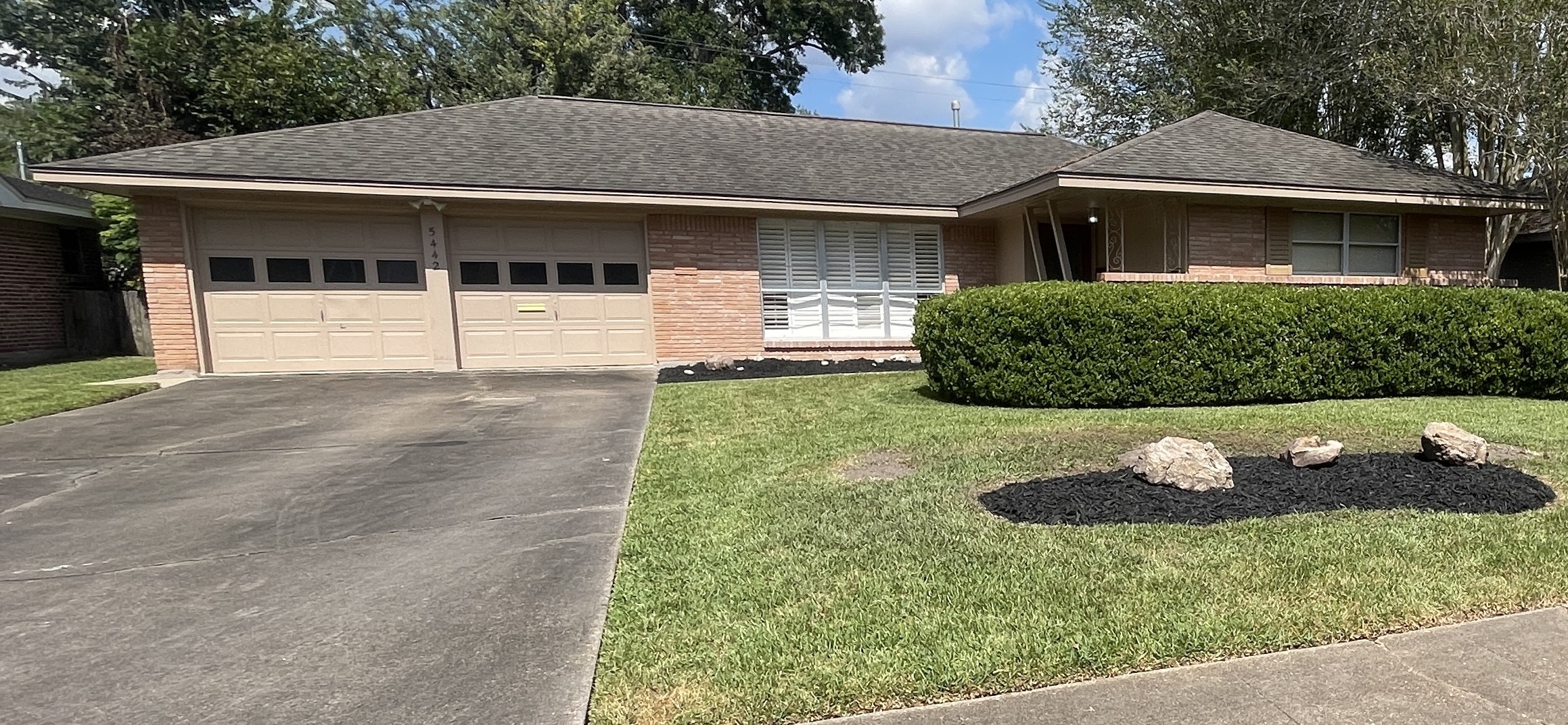 5442 Kinglet Street Houston, TX 77096 - Photo 1 of 25 a front view of a house with a yard