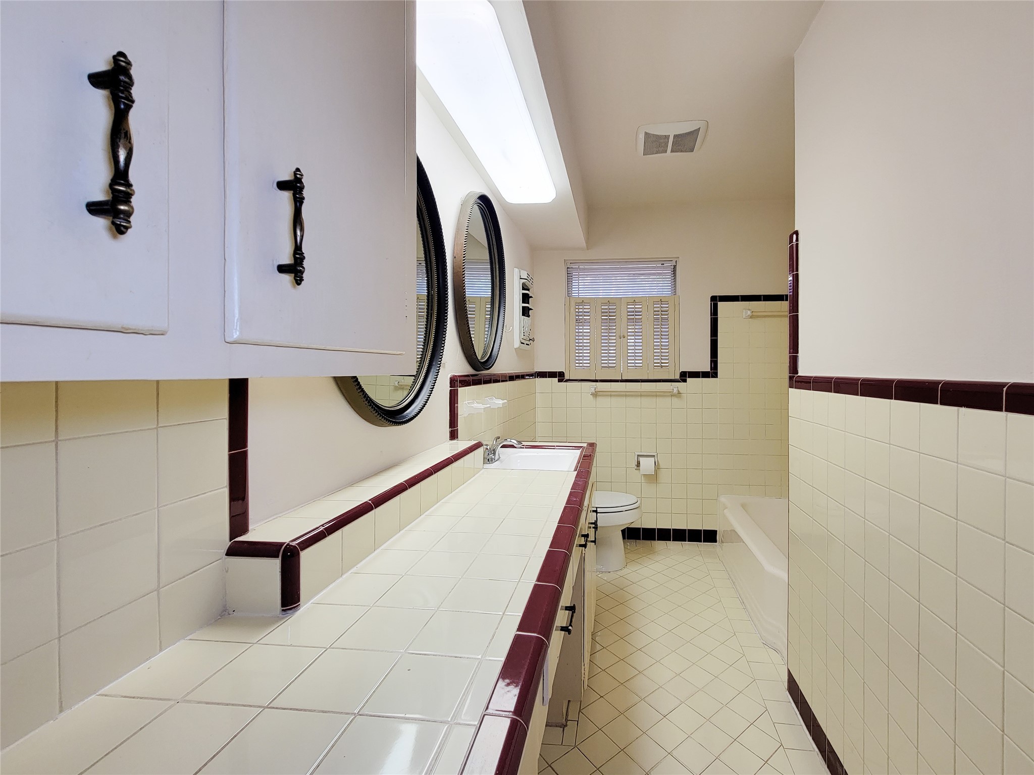 5442 Kinglet Street Houston, TX 77096 - Photo 16 of 25 a bathroom with a sink and mirror