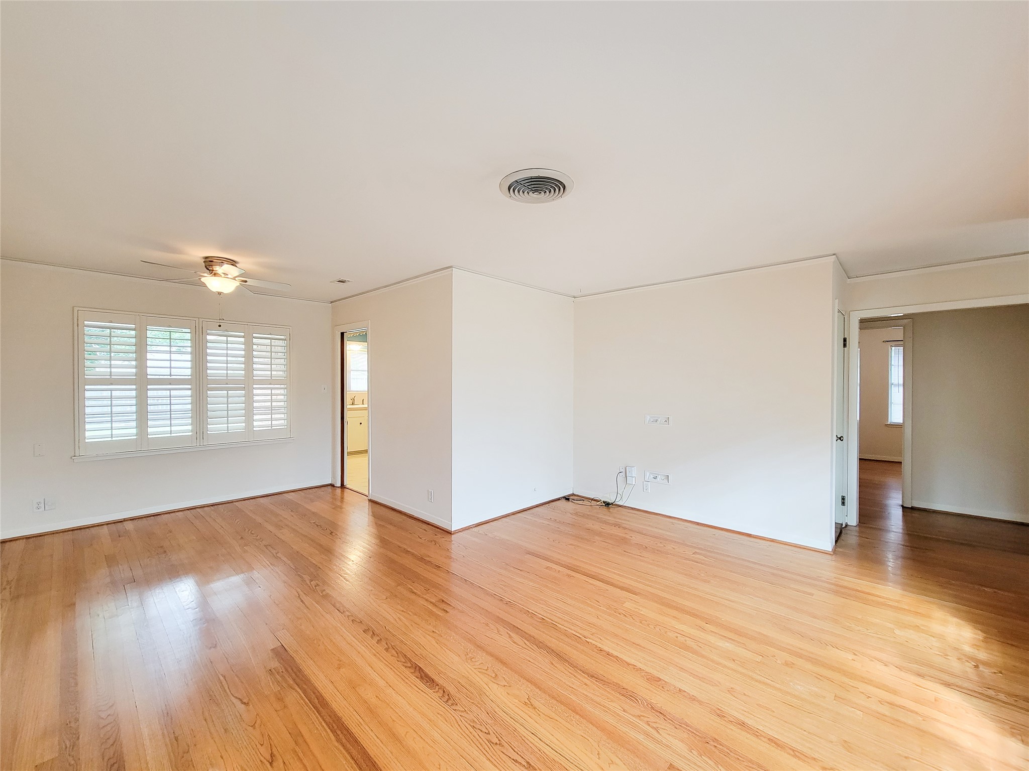 5442 Kinglet Street Houston, TX 77096 - Photo 2 of 25 wooden floor in an empty room with a window