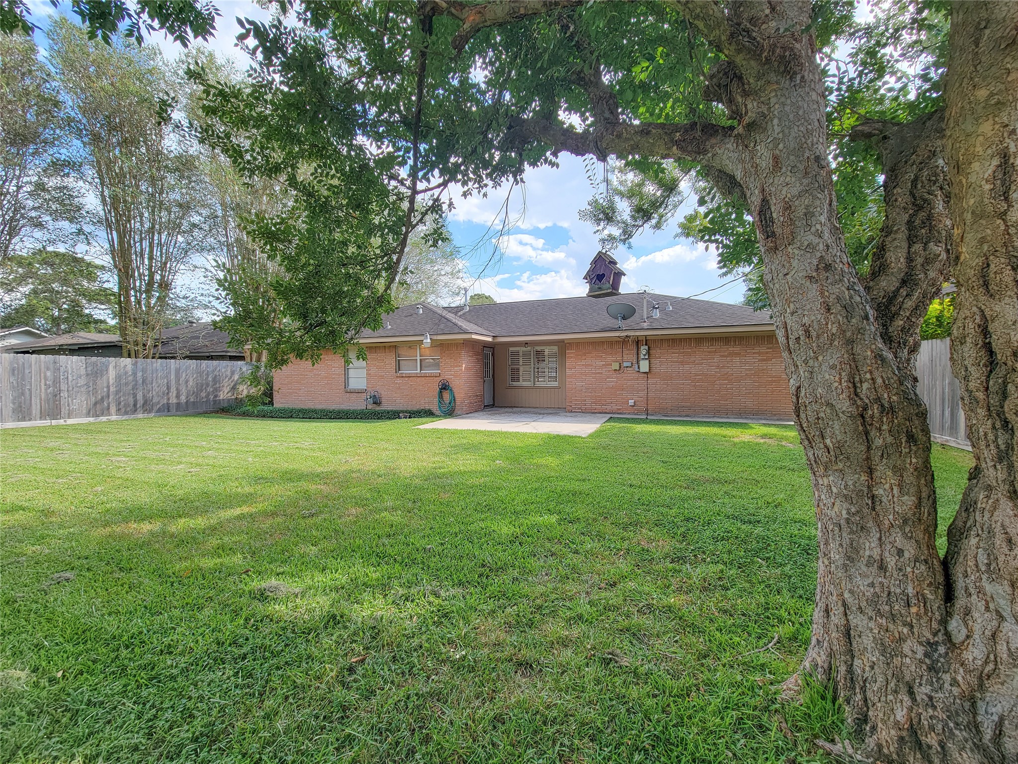 5442 Kinglet Street Houston, TX 77096 - Photo 21 of 25 a view of a house with a yard