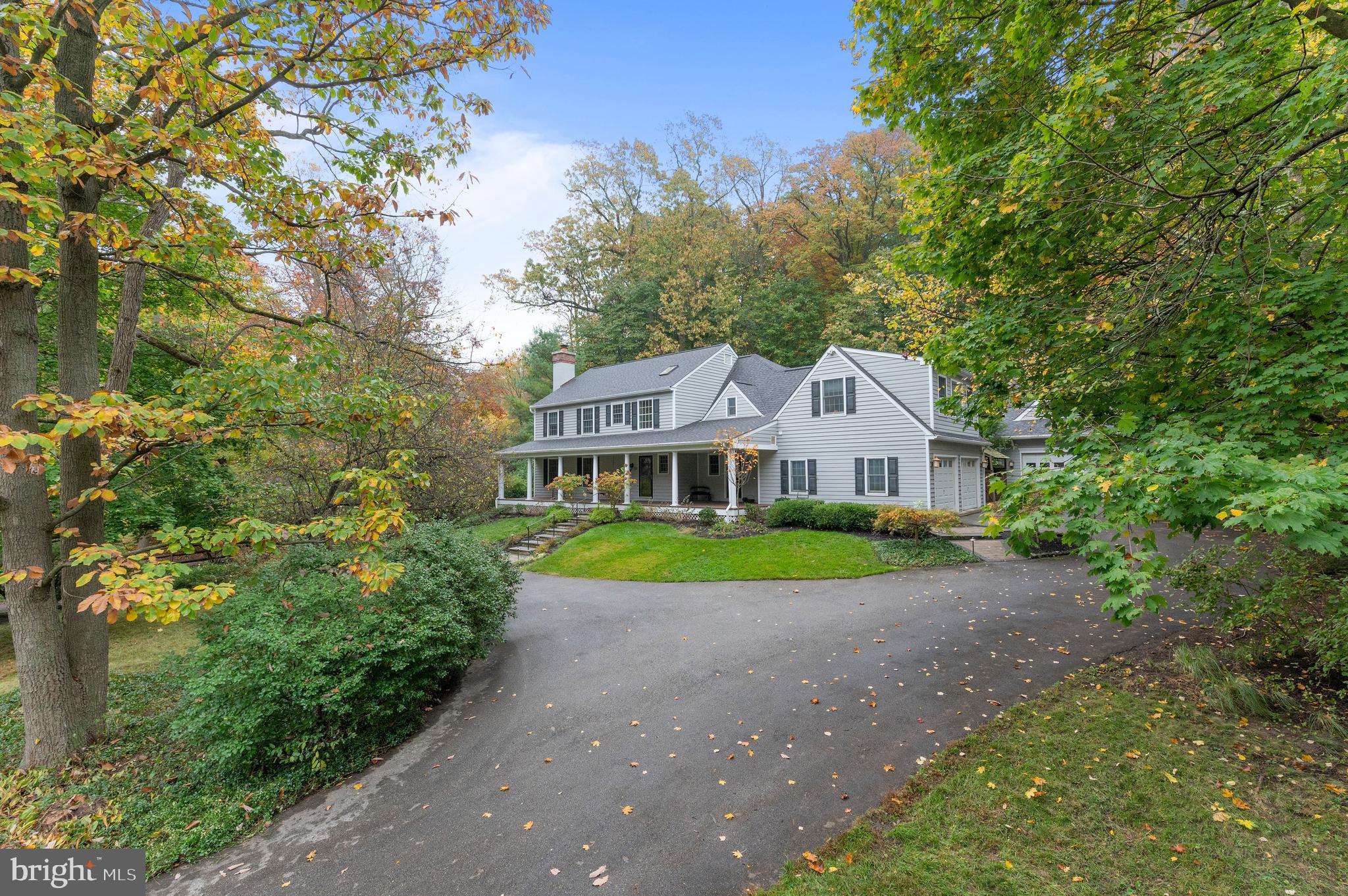 850 Hollow Road Wayne, PA 19087 - Photo 2 of 37 a front view of a house with garden