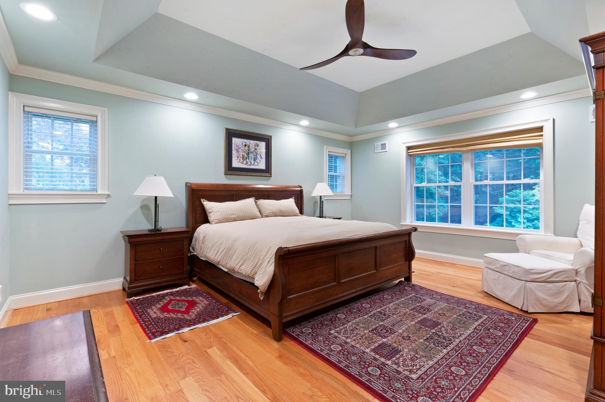 850 Hollow Road Wayne, PA 19087 - Photo 17 of 37 a bedroom with a bed a rug and wooden floor