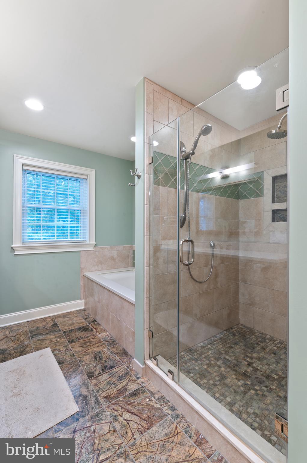 850 Hollow Road Wayne, PA 19087 - Photo 19 of 37 a bathroom with a glass shower door