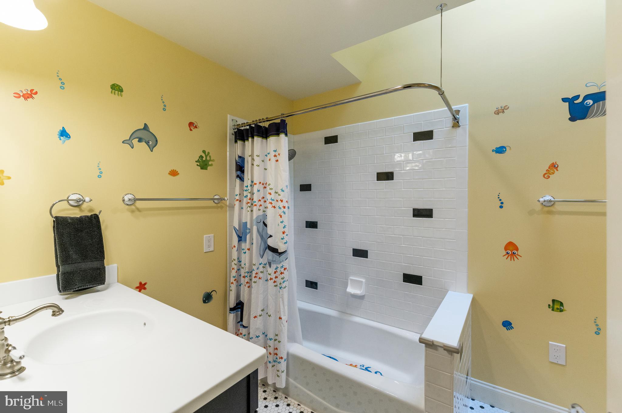850 Hollow Road Wayne, PA 19087 - Photo 22 of 37 a bathroom with a bathtub and a shower