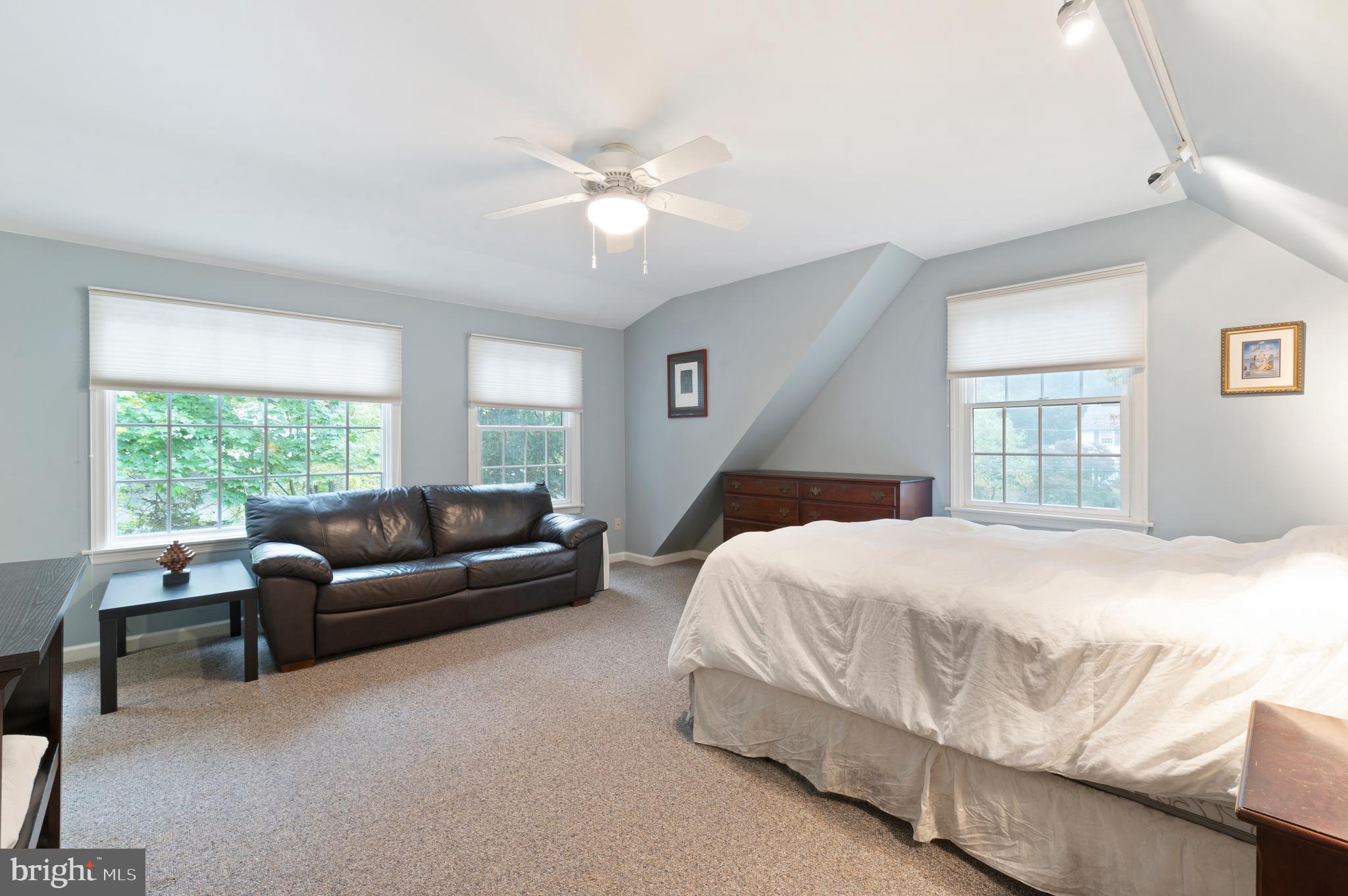 850 Hollow Road Wayne, PA 19087 - Photo 25 of 37 a bedroom with a bed couch and window