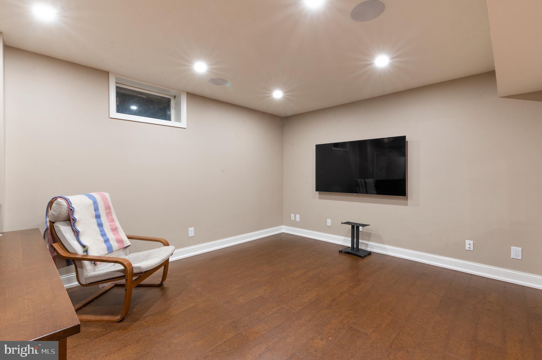 850 Hollow Road Wayne, PA 19087 - Photo 29 of 37 a living room with furniture and a flat screen tv