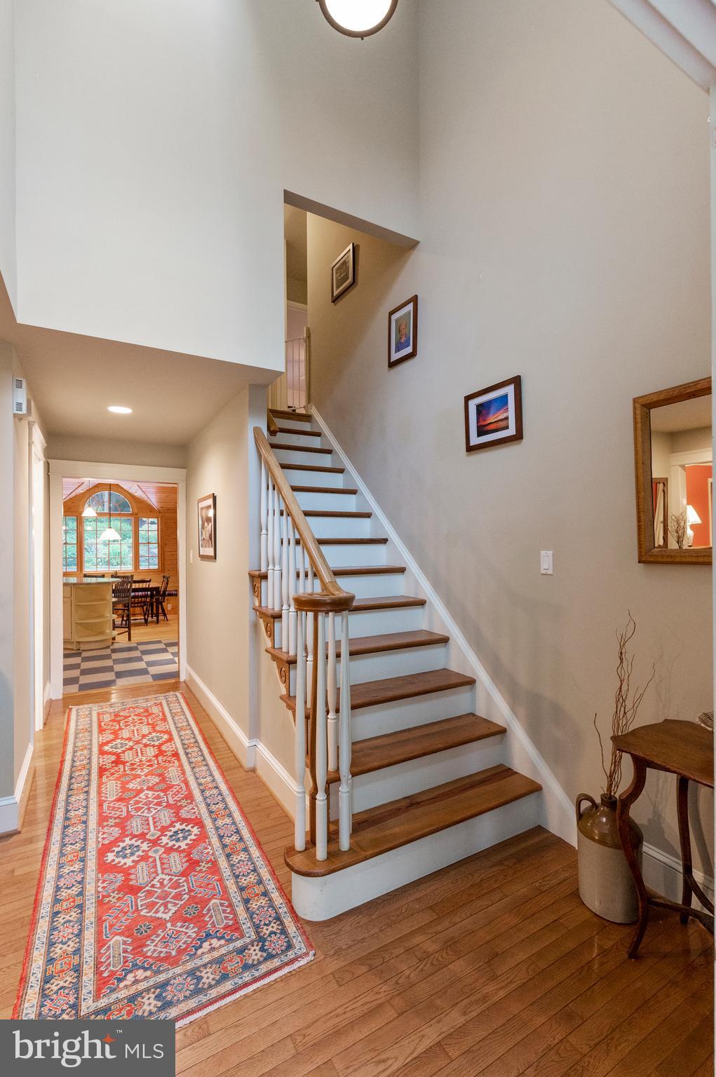 850 Hollow Road Wayne, PA 19087 - Photo 5 of 37 a view of a hallway with wooden floor and stairs