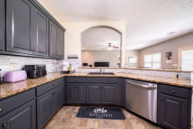 a kitchen with a sink and cabinets